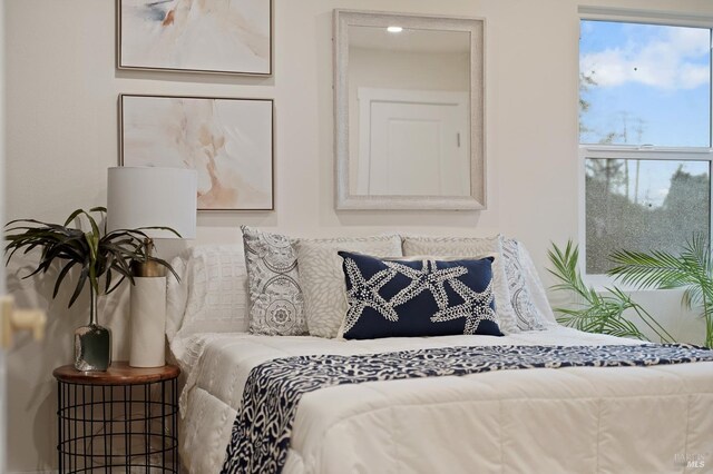 bedroom featuring wood-type flooring and electric panel