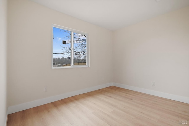 unfurnished room with light hardwood / wood-style floors