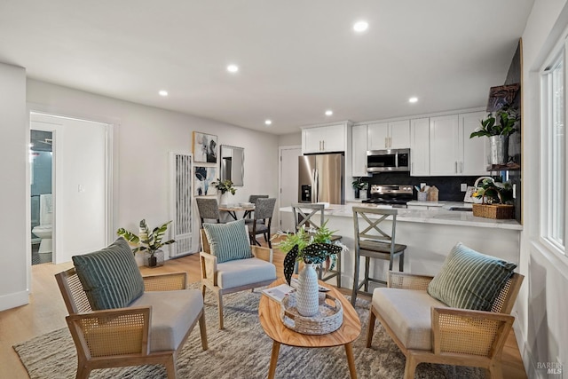 interior space with light hardwood / wood-style floors and sink