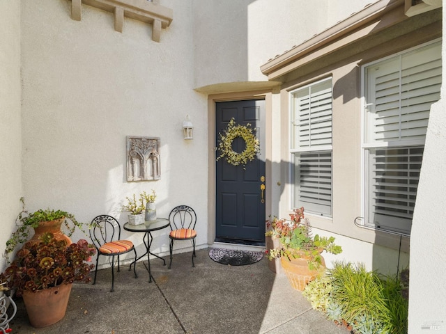 doorway to property featuring a patio area