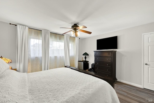 bedroom featuring ceiling fan and dark hardwood / wood-style floors