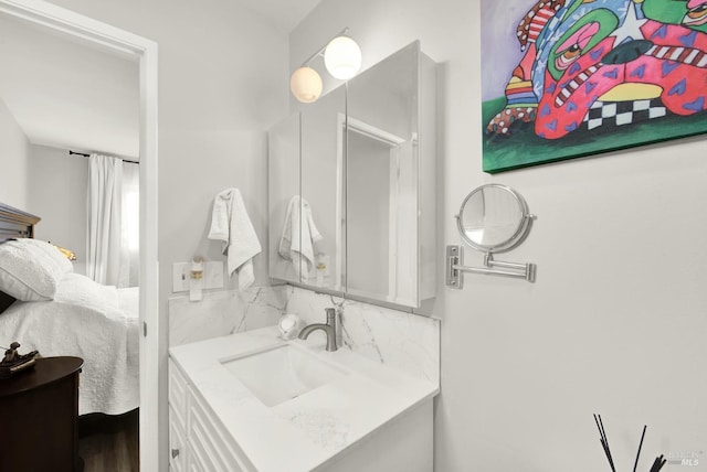 bathroom with vanity and backsplash