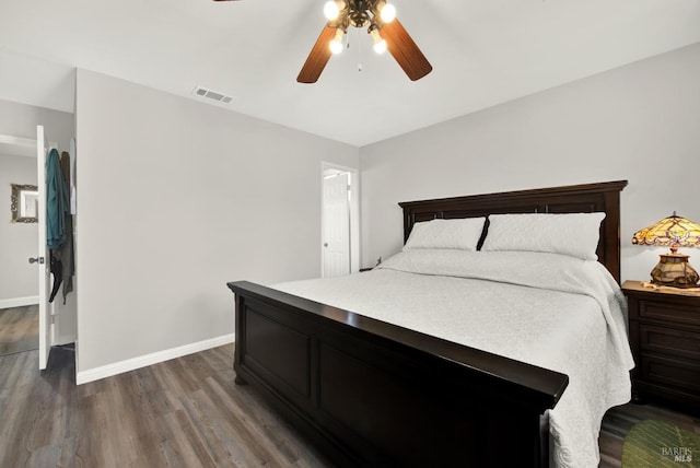 bedroom featuring ceiling fan and dark hardwood / wood-style flooring