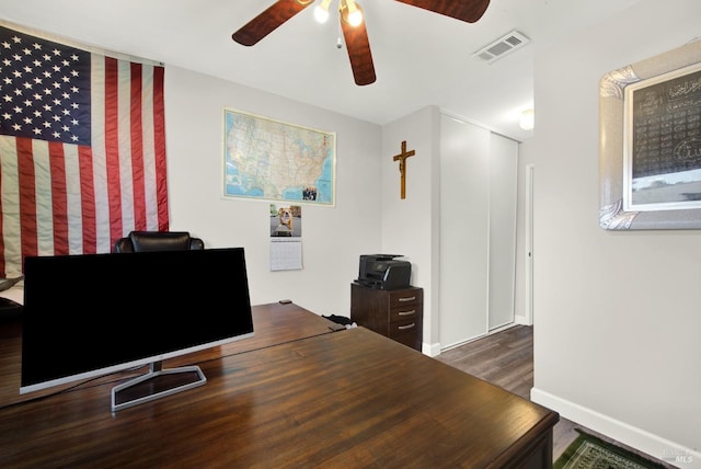 office with ceiling fan and dark hardwood / wood-style flooring