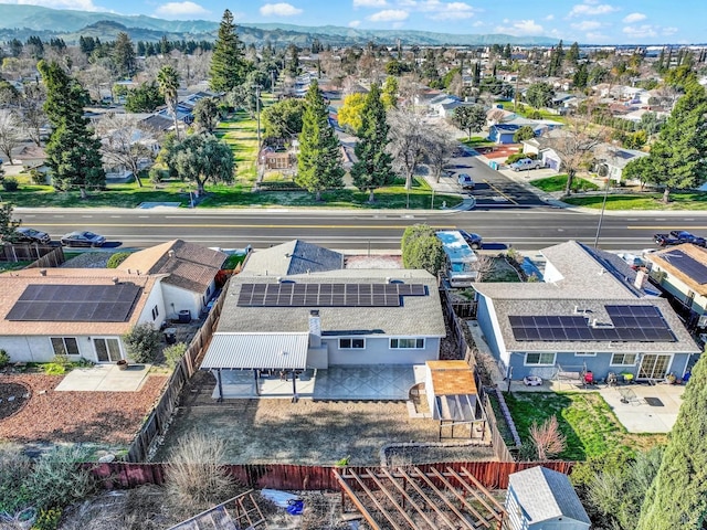 birds eye view of property featuring a mountain view