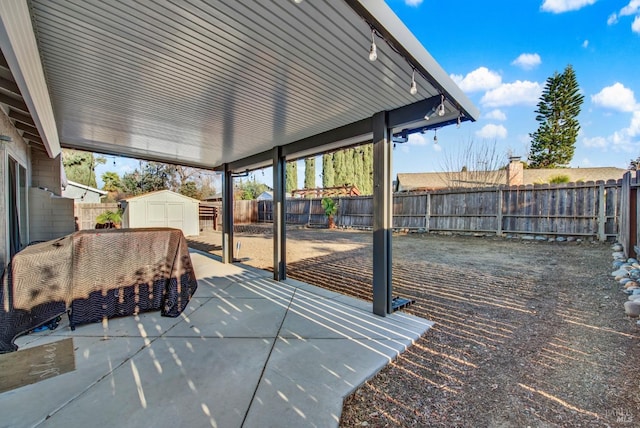 view of patio with a storage unit