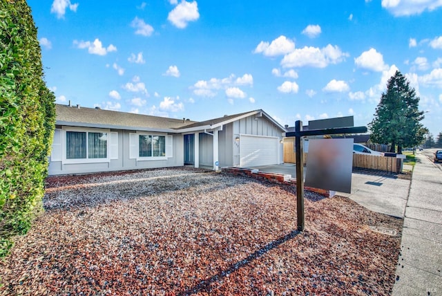 single story home with a garage