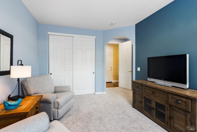 living room featuring light carpet