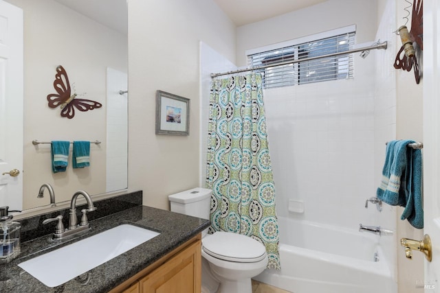 full bathroom with vanity, shower / tub combo, and toilet