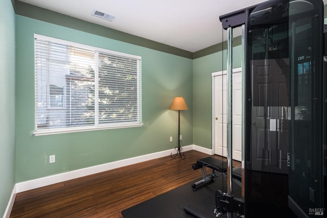 exercise area featuring hardwood / wood-style floors