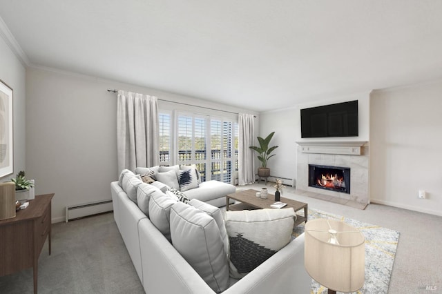 living room with baseboards, a baseboard heating unit, a tiled fireplace, and carpet flooring