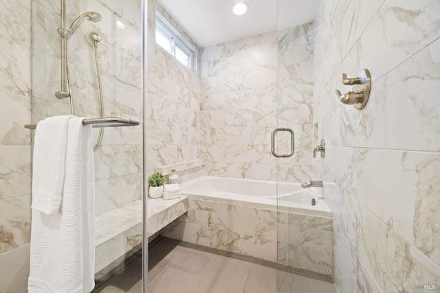 bathroom with independent shower and bath, tile walls, and tile patterned floors