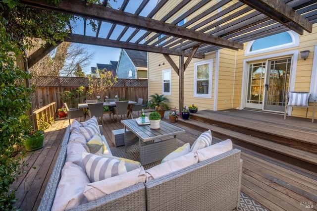 wooden terrace featuring an outdoor hangout area and a pergola
