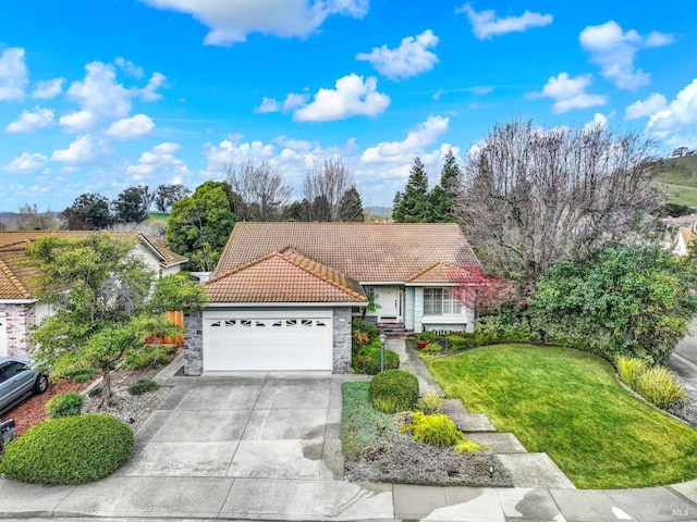 view of front of house with a garage and a front yard