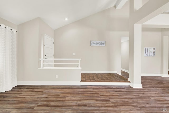 unfurnished living room featuring beamed ceiling, dark hardwood / wood-style floors, and high vaulted ceiling