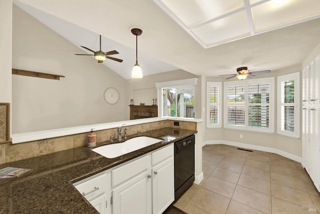 kitchen featuring sink, white cabinetry, hanging light fixtures, light tile patterned floors, and dishwasher