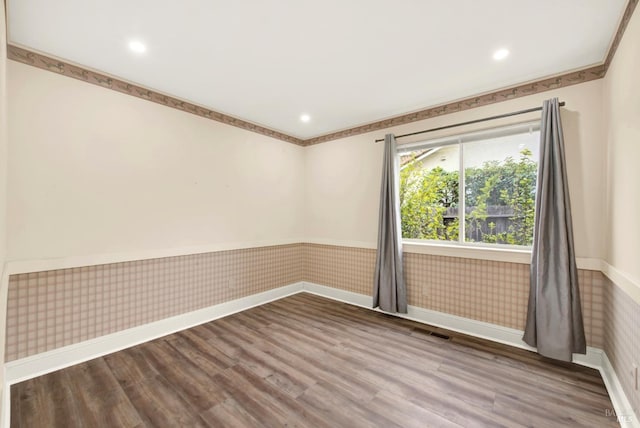 empty room featuring hardwood / wood-style flooring