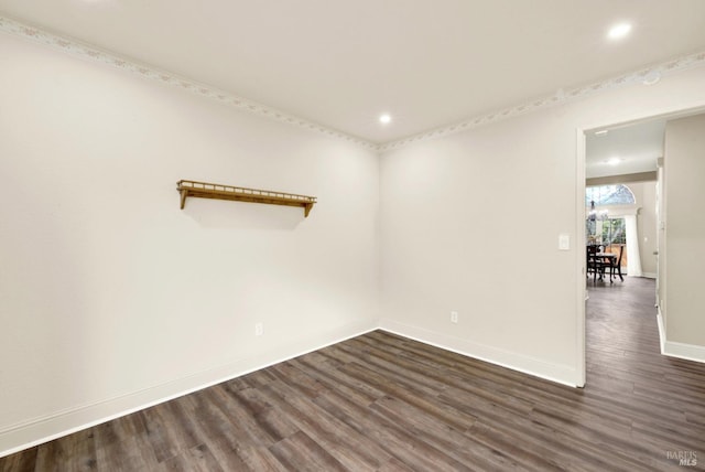 unfurnished room featuring dark wood-type flooring