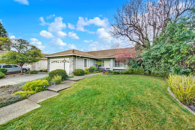 ranch-style home with a garage and a front lawn