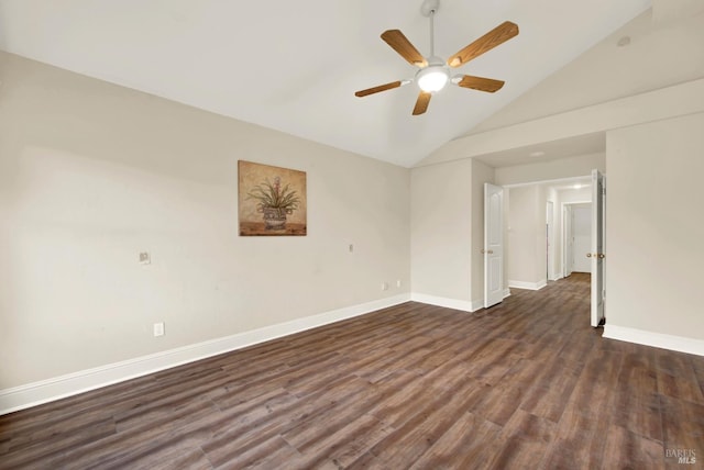 empty room featuring ceiling fan, lofted ceiling, and dark hardwood / wood-style flooring