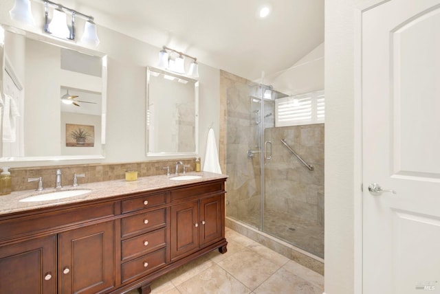 bathroom featuring vanity, tile patterned flooring, decorative backsplash, and walk in shower