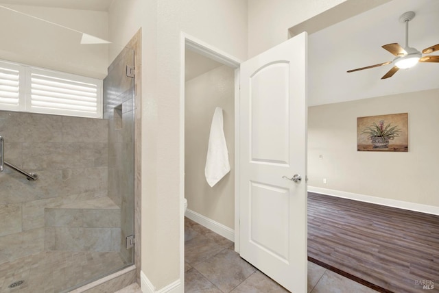 bathroom featuring toilet, tile patterned floors, ceiling fan, and walk in shower