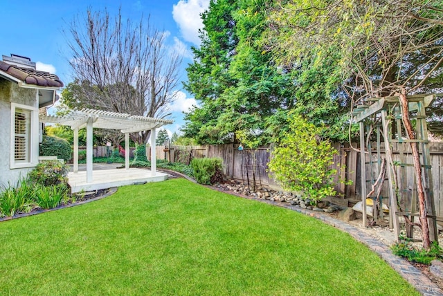 view of yard with a wooden deck and a pergola