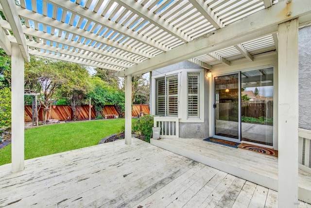 wooden deck with a pergola and a lawn