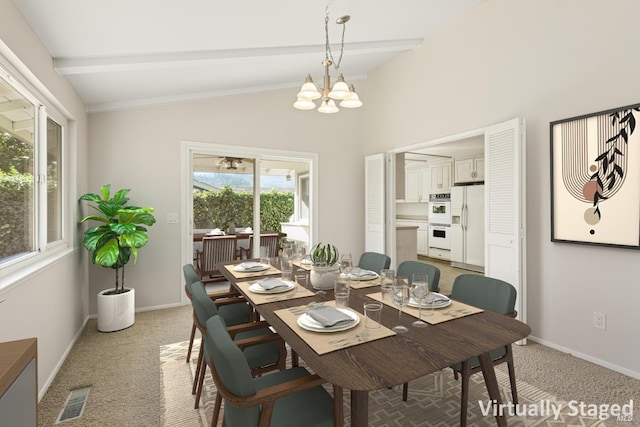 dining room with an inviting chandelier, light colored carpet, and lofted ceiling with beams