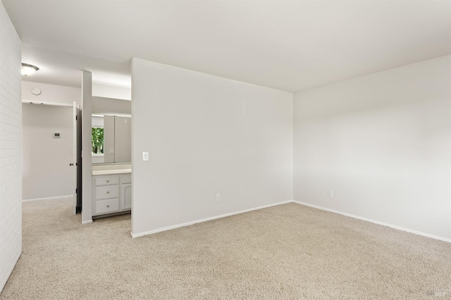 empty room with light colored carpet