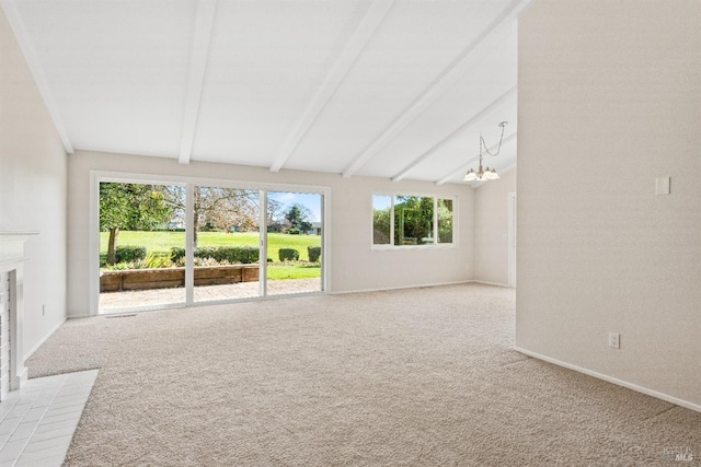 unfurnished living room featuring lofted ceiling with beams, an inviting chandelier, light carpet, and a tile fireplace