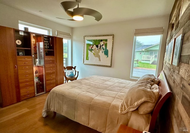 bedroom featuring ceiling fan and wood-type flooring