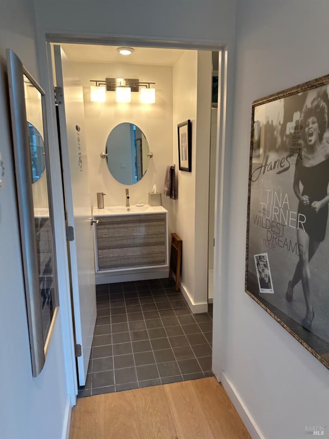 bathroom featuring vanity and wood-type flooring