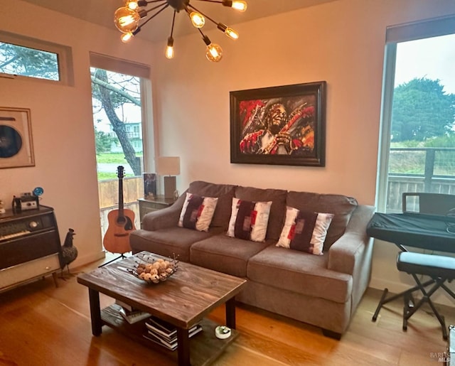 living room featuring hardwood / wood-style flooring and a notable chandelier