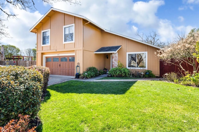 view of front of house featuring driveway, a front yard, an attached garage, and fence