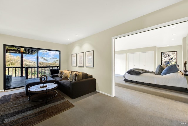 living room featuring recessed lighting, carpet floors, and baseboards