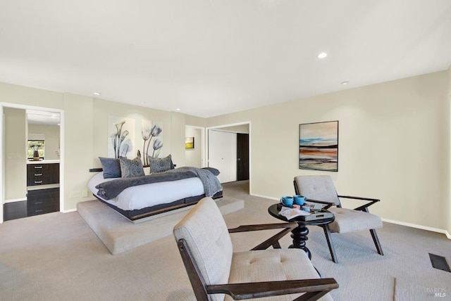 carpeted bedroom featuring recessed lighting and baseboards