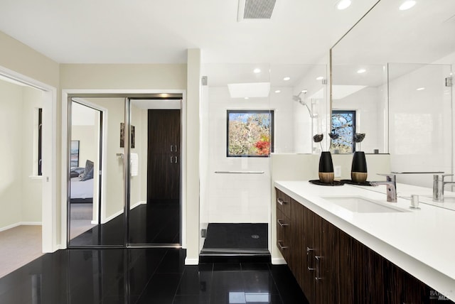 full bathroom with tile patterned flooring, visible vents, vanity, baseboards, and a stall shower