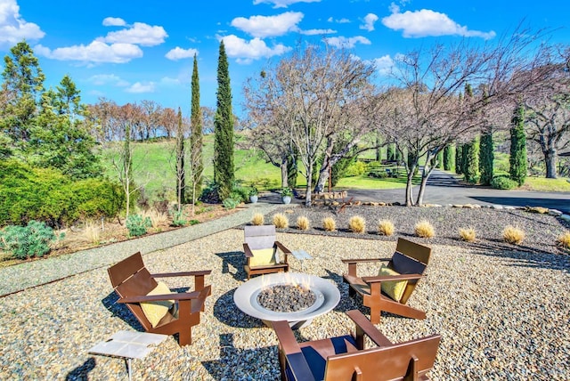 exterior space featuring an outdoor fire pit