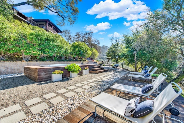 view of patio featuring a jacuzzi