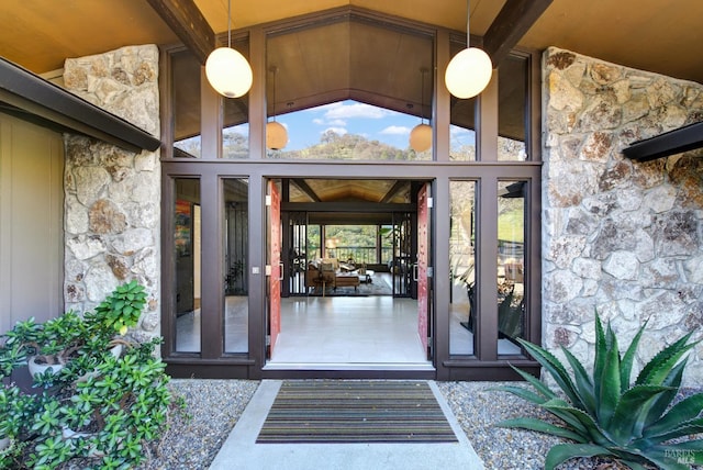 property entrance with stone siding