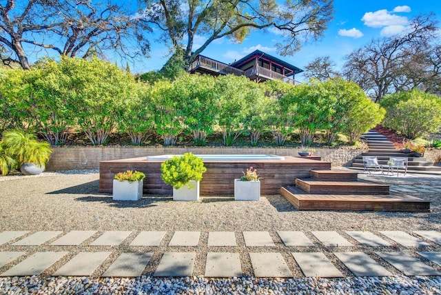 view of patio with a jacuzzi
