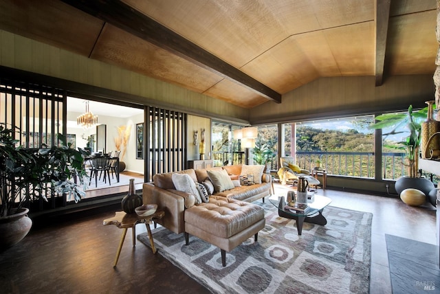 sunroom featuring beamed ceiling and an inviting chandelier
