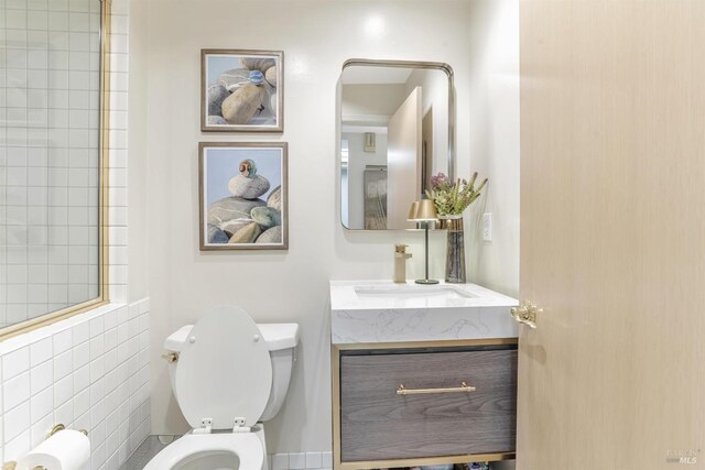 bathroom with vanity and toilet