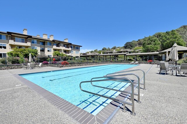 view of swimming pool with a patio area