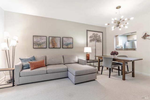 carpeted living room featuring a notable chandelier