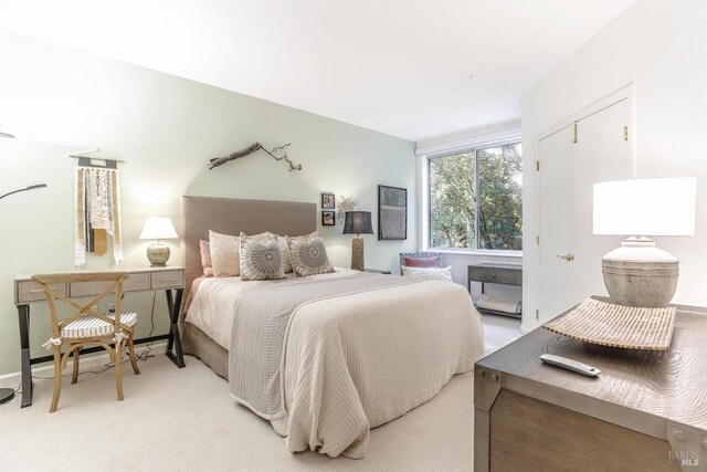 bedroom with light colored carpet