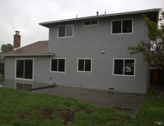 rear view of property featuring a patio area