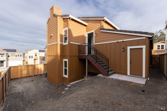 back of property with a fenced backyard