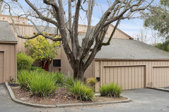 view of property exterior with a garage